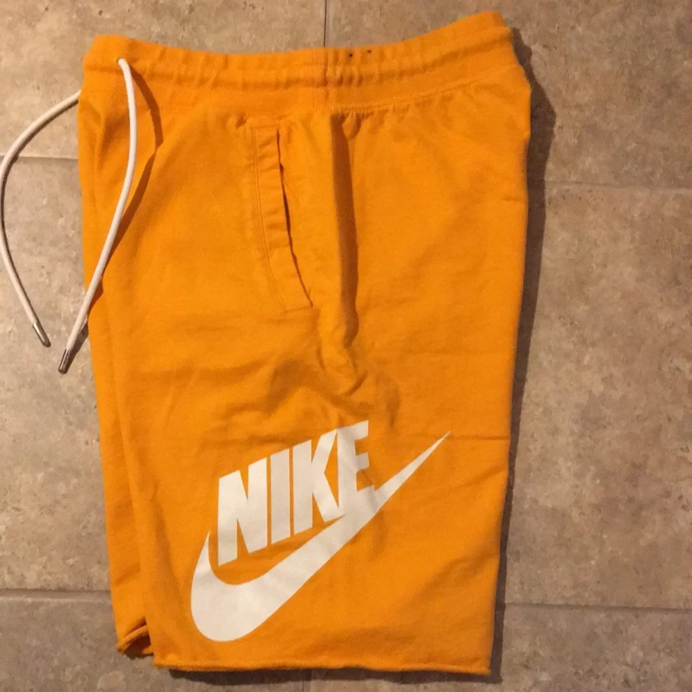Nike Orange Men's Athletic Shorts with White Logo